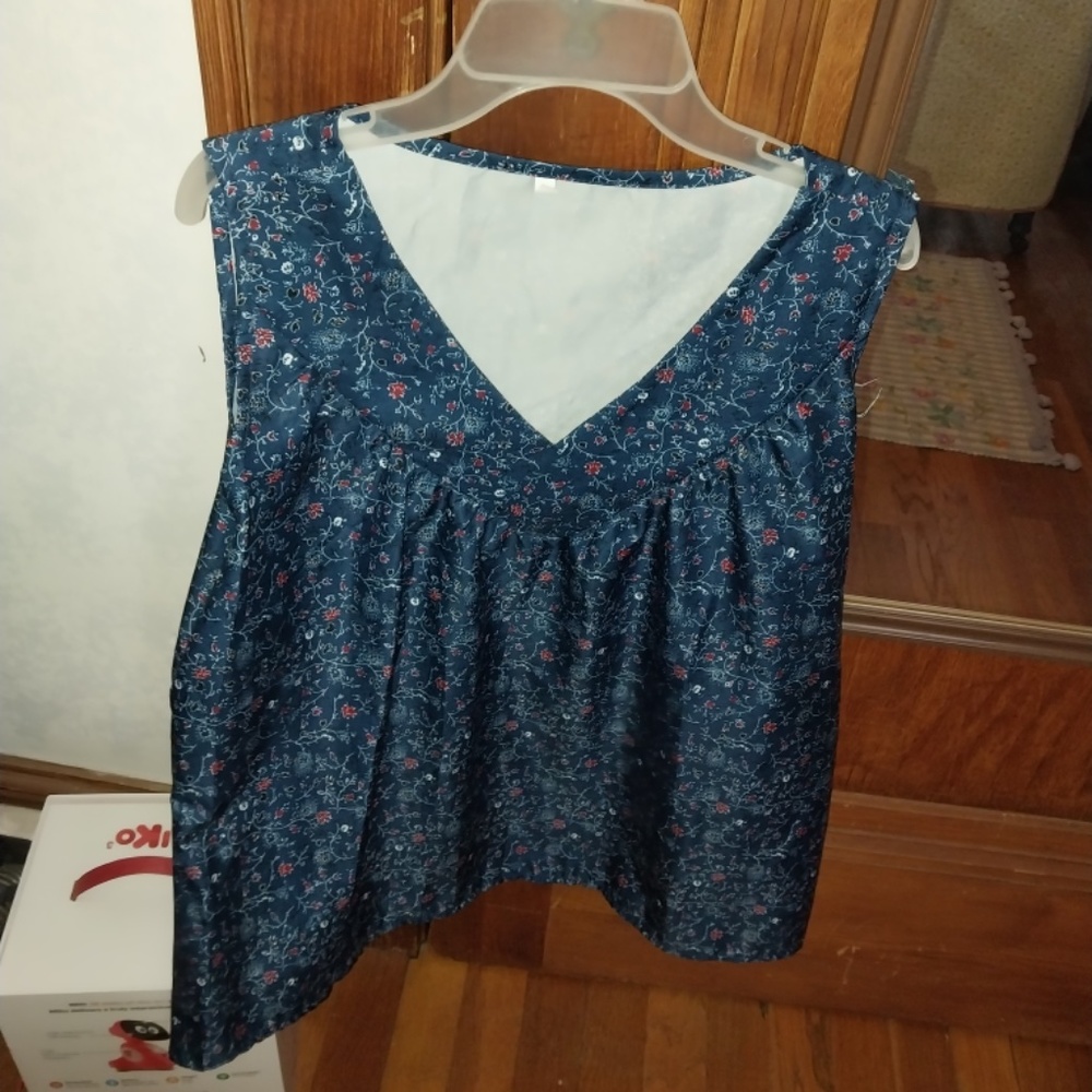 sleeveless blue shiny smock shirt